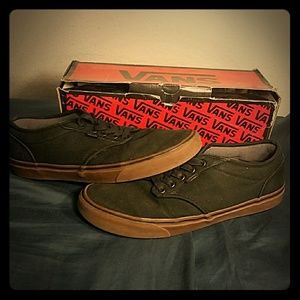 Black vans with brown walls and bottoms